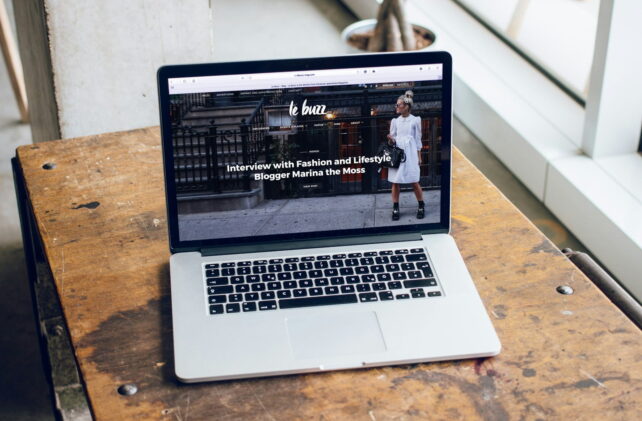 MacBook Pro on brown wooden table